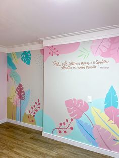 an empty room with painted flowers on the wall