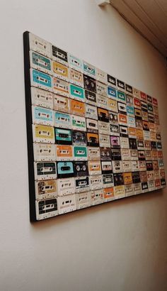 there is a wall hanging made out of cassette tapes