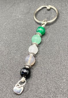 a keychain with many different beads on it