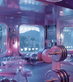 the inside of a train car with mirrors, lights and dumbbells on it