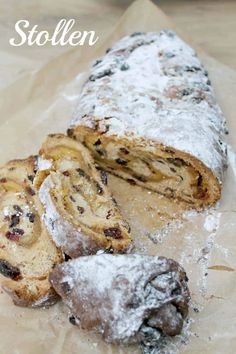 some type of pastry sitting on top of a piece of paper with powdered sugar