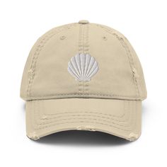 Seashell Embroidered Baseball hat with a slightly distressed brim and crown fabric, it'll add just the right amount of edge to your look. Perfect to wear at the beach! * 100% pre-shrunk cotton twill * Soft crown * 6 sewn eyelets * 6 stitched rows on the brim * 6-panel unstructured cap with a low profile * Seamed front panel without buckram * Adjustable hook and loop closure Cotton Snapback Beach Hat, Cotton Snapback Hat For Beach, Cotton Bucket Hat For The Beach, Cotton Brimmed Hat For Beach Season, Cotton Brimmed Beach Hat, Cotton Baseball Cap For Beach, Beach Cotton Baseball Cap, Beach Cotton Hat With Curved Bill, Cotton Beach Baseball Cap