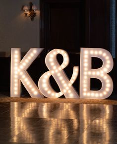 the letters k and b are lit up with lights