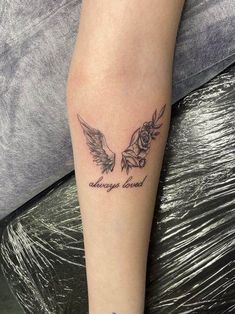 a woman's arm with two birds on it and the words, always loved