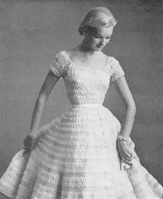 a woman in a dress made out of crochet