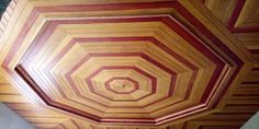 the ceiling is made out of wood and has an unusual pattern on it's surface