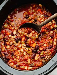 a slow cooker filled with chili and beans