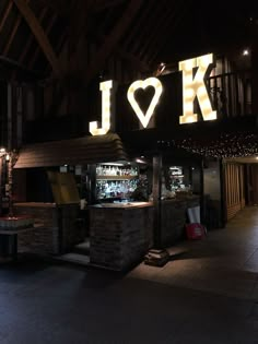 the inside of a restaurant with lights on it's roof and sign that says i love ko