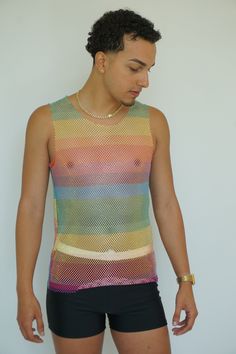 Rainbow Fishnet Long Tank Top by TAINOWEARS, a trendy and versatile sleeveless camisole perfect for making a bold fashion statement. This see-through mesh cover-up features a vibrant rainbow fishnet design, ideal for layering over your favorite bralette or swimsuit. Whether you're heading to the beach, a festival, or a casual day out, this stylish top adds a playful and eye-catching element to any outfit. Crafted from lightweight, breathable fabric, this crystal mesh top ensures comfort while ke Fishnet Mesh Top For Summer Parties, Summer Party Mesh Top With Fishnet Details, Summer Party Fishnet Mesh Top, Sheer Stretch Tank Top, Mesh Camisole Tops For Summer, Sheer Mesh Camisole Top, Sheer Fitted Tank Top For Summer, Fitted Sheer Tank Top For Summer, Fitted Sleeveless Mesh Top