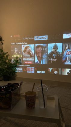 a flat screen tv sitting on top of a white table