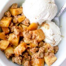 a white bowl filled with ice cream and some type of food on top of it