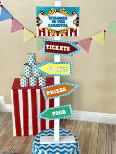 a circus themed birthday party with popcorn boxes and signs on the top of each sign