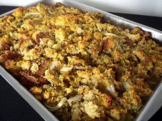 a casserole dish filled with stuffing and vegetables