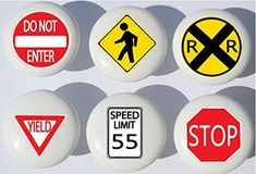 six different traffic signs are shown on the wall