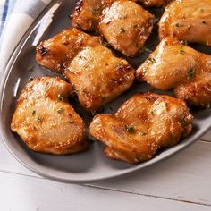 some chicken wings on a plate with a fork