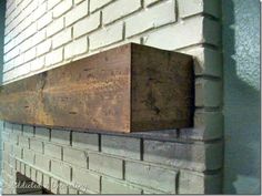 a brick wall with a wooden block on it