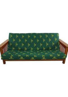 a futon bed with green and yellow letters on the cover, in front of a white background