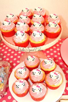 there are many hello kitty cupcakes on the table