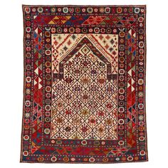 an antique persian rug with geometric design