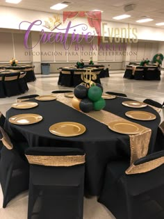 black and gold table cloths are set up in the center of a banquet hall