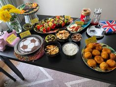 a black table topped with lots of food