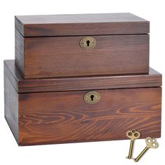 two wooden boxes with gold handles and locks on each side, one is open to show the key hole