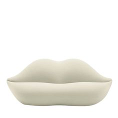 a white bowl that is shaped like a lips on the bottom, with one lip sticking out