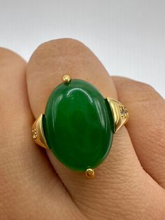 "Vintage Lucky Green Nephrite Jade ring Fun jade is color enhanced  Large green nephrite jade  Ornate German Gold finished Vintage ring, does not tarnish, NOT sterling Size 7, 7.5, 8, or 9.25  Our jeweler can re size for a $20 fee.  All rings are shipped free in the US in a nice gift box.   Check out our over a THOUSAND great reviews Engraving is $4 per letter and is not always perfect depending on the piece. It can take a few days if the jeweler is busy. This is payable to Paypal Judithsltd@gma Fine Jewelry Green Oval Cabochon, Oval Jade Rings Hallmarked, Oval Cabochon Jade Gemstone Jewelry, Oval Green Jewelry With Polished Finish, Fine Jewelry Green Oval Cabochon Rings, Green Emerald Oval Cabochon Ring, Green Oval Gemstone Jewelry, Green Oval Gemstone Rings, Green Emerald Ring With Oval Cabochon