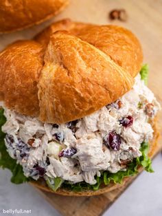 chicken salad sandwich with cranberries and lettuce on ciabatta bread