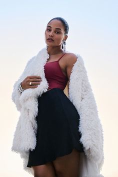 Don't forget a jacket – the season's staple is having a moment. This faux-fur number flaunts a high-low hem and subtle collar. | Faux-Fur Jacket by Daily Practice by Anthropologie in Beige, Women's, Size: 2XS, Polyester/Viscose/Elastane Mini Slip Skirt, Fur Leather Jacket, Ruffle Bodysuit, Beige Jacket, Anthropologie Jacket, Pleated Skirts, Lace Bustier, Mini Slip, Simply Chic