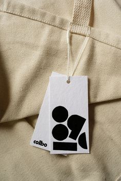 a tag with the word colbo on it is hanging from a piece of clothing