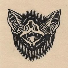 a black and white drawing of a cat's head with fangs on its face