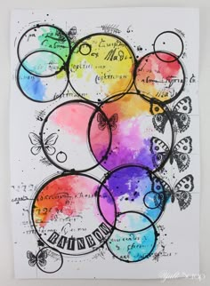 an art project with watercolors and ink on paper, depicting different colors in circles