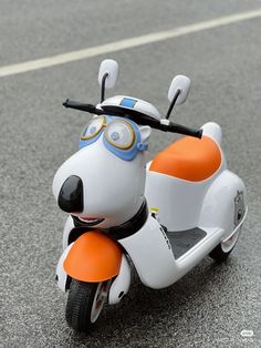 a toy scooter with a dog on it