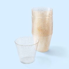 a stack of glass cups sitting next to each other