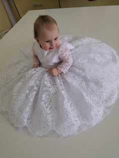 If you are looking for a beautiful christening dress! You found it :) Sewn with love and attention to detail, this is a charming christening dress. The perfect birthday gift. The dress can be sewn in two versions of lace fabric-white and ivory. The dress is floor-length, but at your request it can be sewn to any length. The top of the dress is made of high-quality guipure with beautiful flowers. There are also long sleeves. The skirt is lush, with many layers of tulle. The lining of the dress is made of 100% cotton. If your sizes do not meet our standards, we can sew the dress individually. Feel free to contact us if you have any questions The dress is made to order within 7-14 days White Lace Patchwork Princess Dress For Wedding, Elegant White Dress For First Birthday, White Lace Patchwork Princess Wedding Dress, White Princess Style Baptism Dress For First Birthday, White Princess Baptism Dress For First Birthday, White Princess Lace Dress For First Communion, White Princess Dress With Lace Patchwork, White Elegant Baptism Dress For First Birthday, Elegant White Baptism Dress For First Birthday