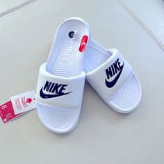 Brand New!!! Nike Slides With Enhanced Soft Materials Making It Super Comfy. Color Is White With Black. Final Sale. No Return Or Exchange White Sports Sandals With Cushioned Footbed, White Round Toe Sports Sandals, White Open Toe Slides For Sports, White Non-slip Sandals For Streetwear, Non-slip White Sandals For Streetwear, White Slip-on Sandals For Streetwear, Nike White Sandals For Streetwear, White Nike Sandals For Streetwear, White Sporty Synthetic Sandals