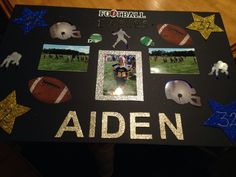 a decorated table with football pictures and glitter stars on it that says, adien