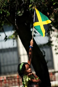 a woman holding a flag in the air