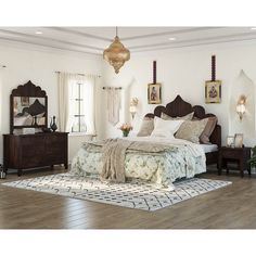 a large bed sitting inside of a bedroom on top of a hard wood floor