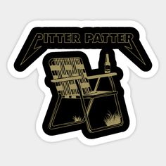 a black and gold sticker with an image of a lawn chair in the grass