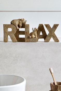 the word relax is made out of wood and bears