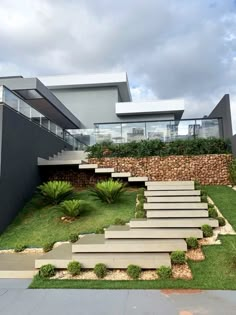 a modern house with stone steps leading up to it