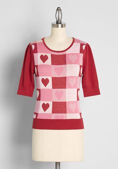 So perfect for spreading some love this Valentine’s Day and beyond, the bodice of this vintage-inspired top from UK brand Collectif boasts an intarsia knit design of checkered squares in delicate shades of red, white, and pink, with some showcasing beautiful heart motifs at the center. Made from soft cotton fabric, this cozy knit top features elbow-length red sleeves with delicate shirring at the shoulders, a round neckline, and red, ribbed-knit detailing at the cuffs, collar, and hemline. Cotto Vintage Style Swimwear, Plus Size Vintage Clothing, Designer Plus Size Clothing, Cute Red Dresses, Casual Dresses Plus Size, Midi Dress Plus Size, Unique Sweaters, Red Dress Women, Plus Size Outerwear