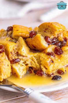 a white plate topped with bread and raisins