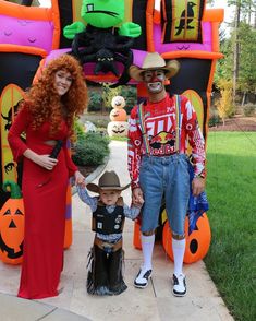 a man, woman and child dressed up in halloween costumes