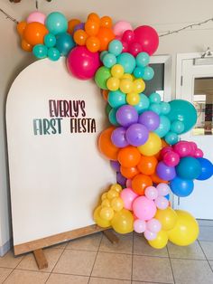 Colorful First Fiesta themed Balloon garland with cut vinyl Bright Colored Balloon Arch, Rainbow Color Balloon Garland, Vibrant Balloon Garland, Balloon Garland Colorful, Multi Colored Balloon Garland, First Fiesta Backdrop, First Fiesta Balloon Arch, Mexican Fiesta Balloon Garland, Colourful Balloon Decorations