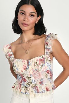 Love will always find you when you've got a romantic look like the Lulus Charmingly Sweet Cream Floral Print Lace Bustier Top! Lightweight woven fabric, with a pink and blue floral print throughout, shapes this vintage-inspired top that has ruffled straps with a peekaboo of adorable eyelash lace. Bodice boasts a bustier-inspired silhouette with pleated cups and a row of hook-and-eye closures at the front. Ruffled hem boasts a matching layer of eyelash lace to complete the look. Fit: This garment Summer Vacay Nails, Lace Top Design, Vacay Nails, Lace Bustier Top, Corset Design, Romantic Floral Print, Floral Bustier, Romantic Tops, Sweet Cream