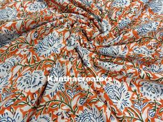 an orange and blue floral print fabric