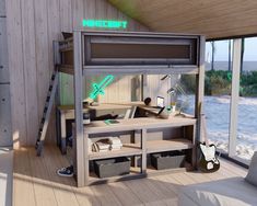 a computer desk sitting on top of a wooden floor next to a wall with windows